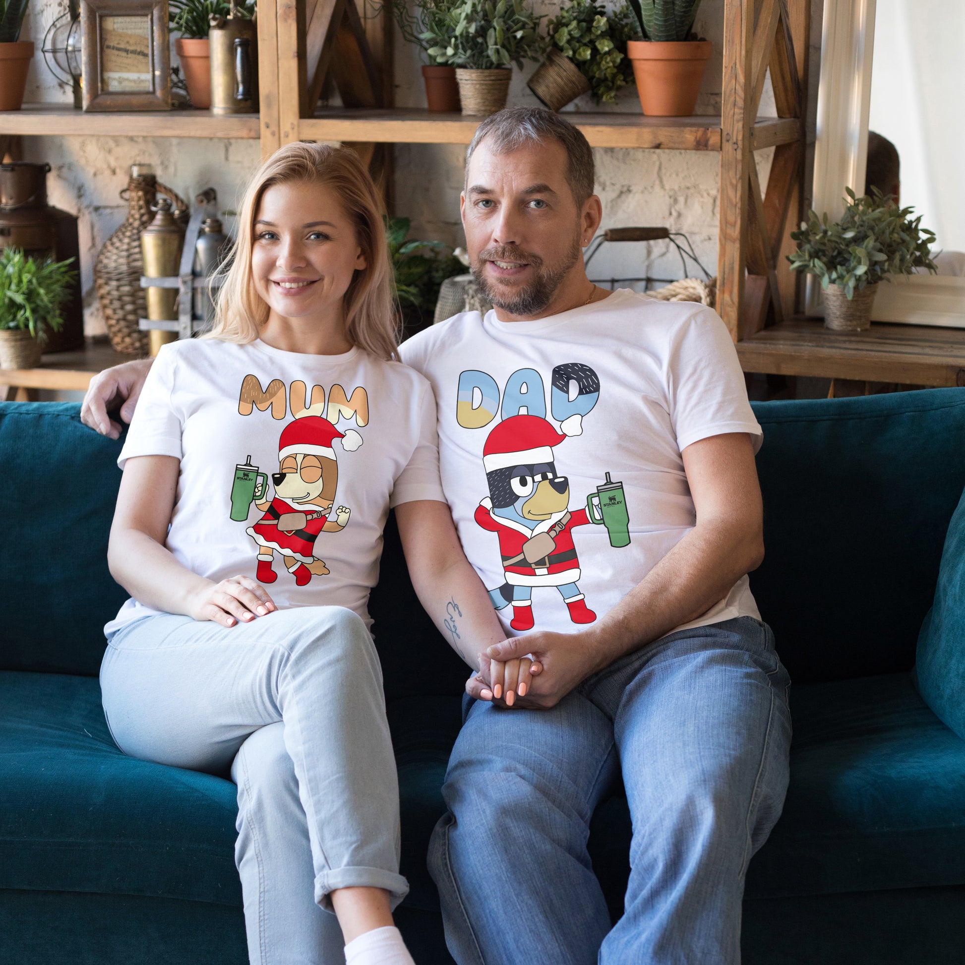 Bandit and Chilli, Bluey’s parents, dressed in Santa Claus outfits holding green Stanley tumblers, with 'Dad' and 'Mum' text above, perfect for Christmas crafts